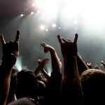 a crowd shadow of people at during a concert